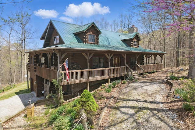 4840 N Templin Rd, Martinsville, IN 46151 - view of front of house with log siding, covered porch, a chimney, and metal roof