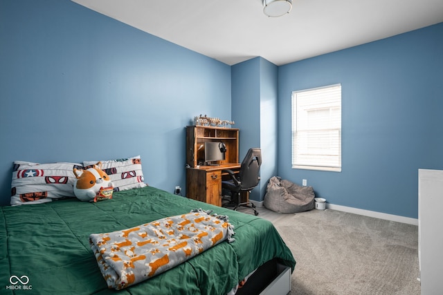 bedroom featuring baseboards and carpet flooring