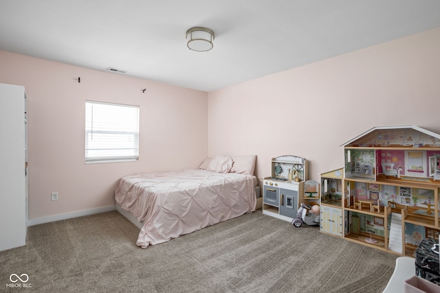 bedroom with carpet flooring, baseboards, and visible vents