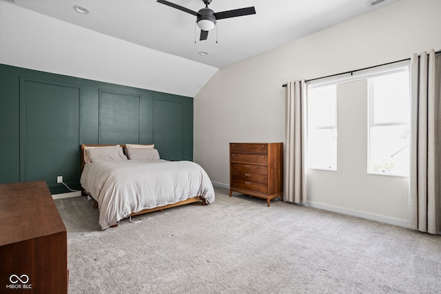 carpeted bedroom featuring baseboards, a ceiling fan, and lofted ceiling