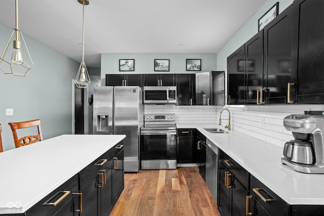 kitchen with dark cabinets and stainless steel appliances