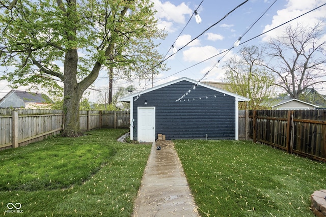 view of yard featuring an outbuilding and a fenced backyard