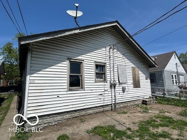 view of side of property with fence