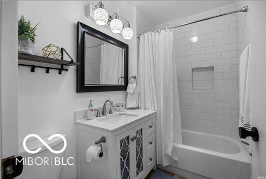 1391 S River Rd, Covington, IN 47932 - bathroom with shower / bath combo with shower curtain and a sink