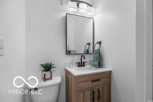 1391 S River Rd, Covington, IN 47932 - half bath with vanity and toilet