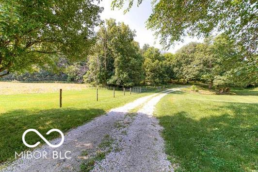 1391 S River Rd, Covington, IN 47932 - surrounding community featuring a yard and gravel driveway