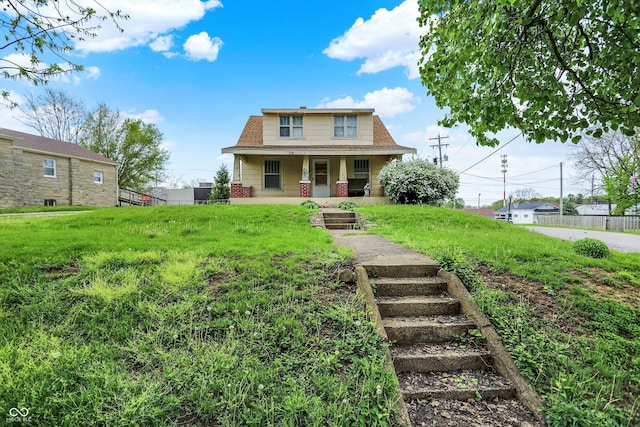 509 S Main St, Greencastle, IN 46135 - bungalow with a porch, fence, a shingled roof, and a front lawn