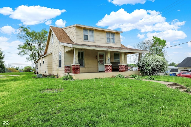509 S Main St, Greencastle, IN 46135 - view of front facade featuring a front yard, roof with shingles, and covered porch