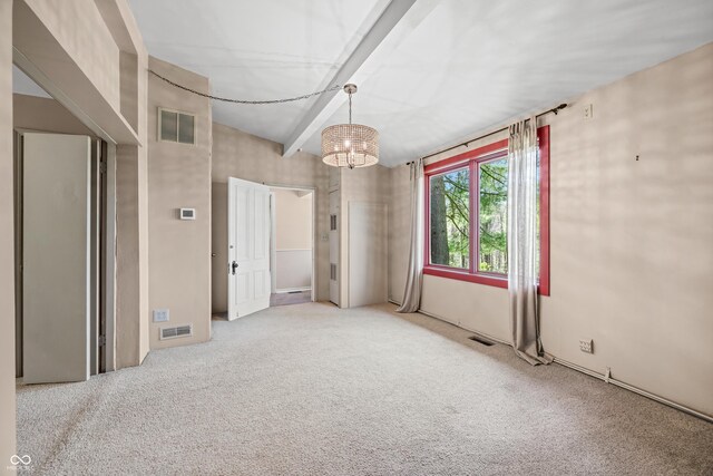 2513 Grandma Barnes Rd, Nashville, IN 47448 - carpeted empty room with visible vents and an inviting chandelier