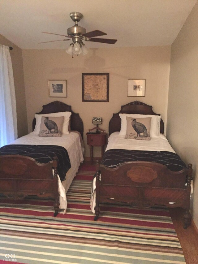 2513 Grandma Barnes Rd, Nashville, IN 47448 - bedroom featuring baseboards, ceiling fan, and wood finished floors