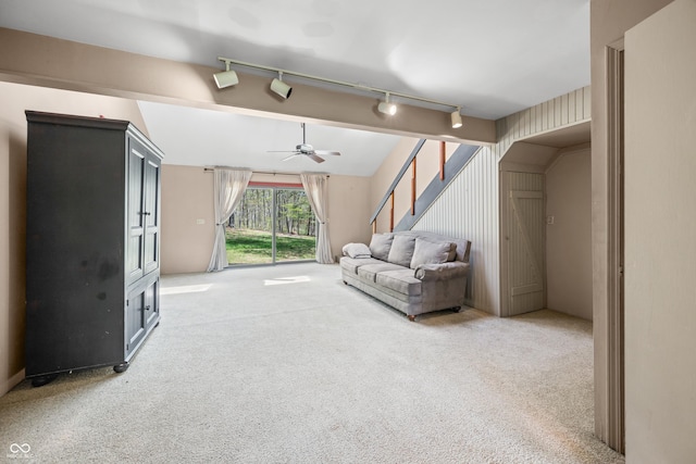 2513 Grandma Barnes Rd, Nashville, IN 47448 - living area with track lighting, a ceiling fan, stairs, and light colored carpet