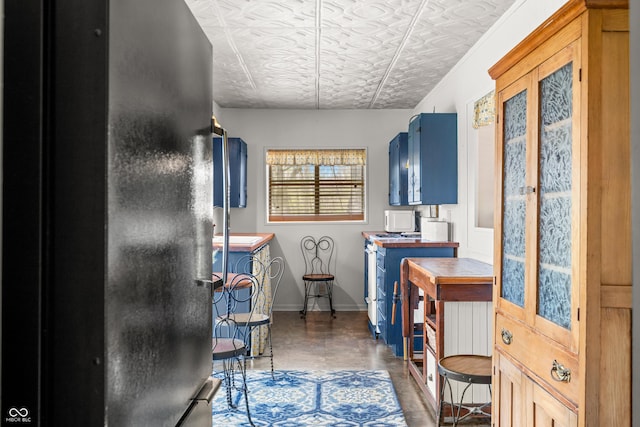 2513 Grandma Barnes Rd, Nashville, IN 47448 - bathroom with an ornate ceiling, baseboards, vanity, and finished concrete flooring