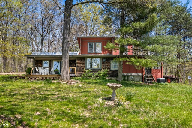 2513 Grandma Barnes Rd, Nashville, IN 47448 - back of property featuring central air condition unit and a yard