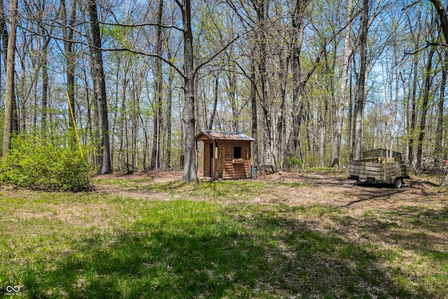 2513 Grandma Barnes Rd, Nashville, IN 47448 - view of yard with a shed, an outbuilding, and a forest view