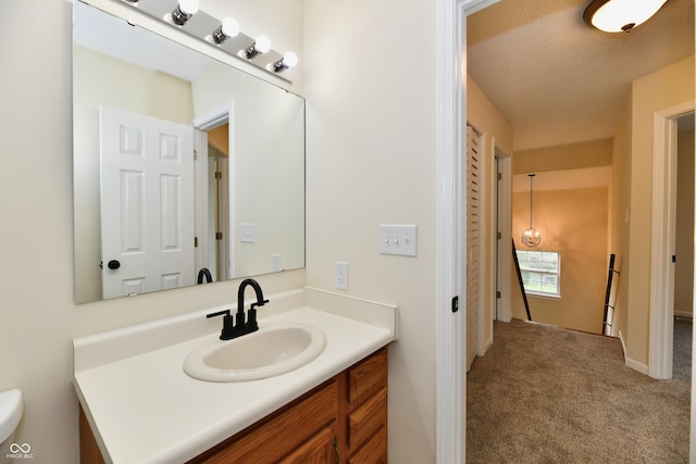 bathroom with baseboards and vanity