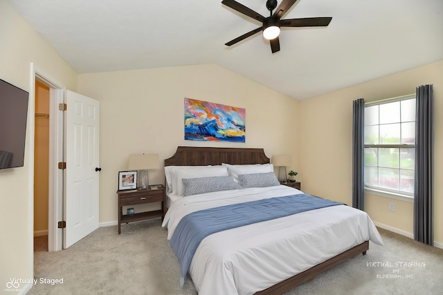 bedroom featuring baseboards, a ceiling fan, carpet, and vaulted ceiling