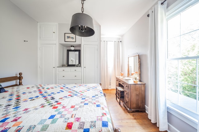 bedroom with light wood-style floors