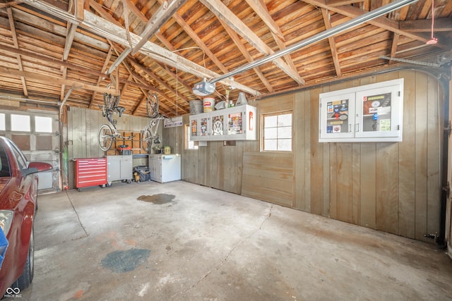garage featuring wooden walls