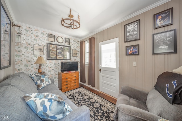 living area featuring crown molding and wood finished floors