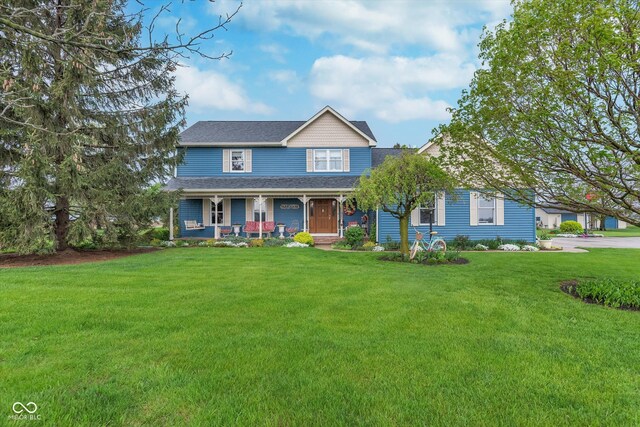 7020 N 375 E, Lebanon, IN 46052 - view of front of home featuring roof with shingles, a porch, and a front yard