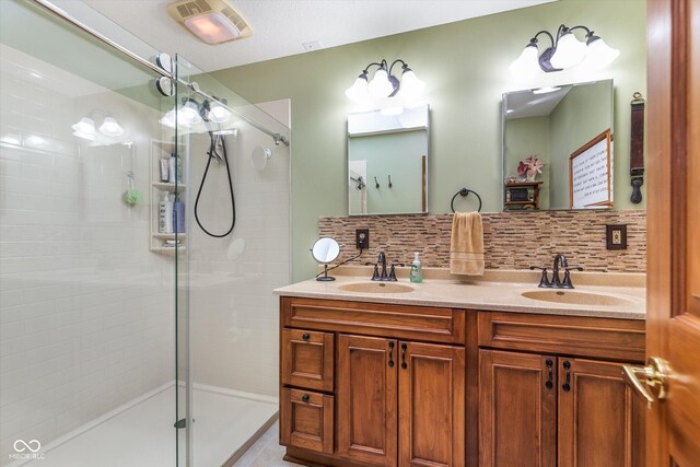 7020 N 375 E, Lebanon, IN 46052 - bathroom with double vanity, a stall shower, a sink, and tasteful backsplash