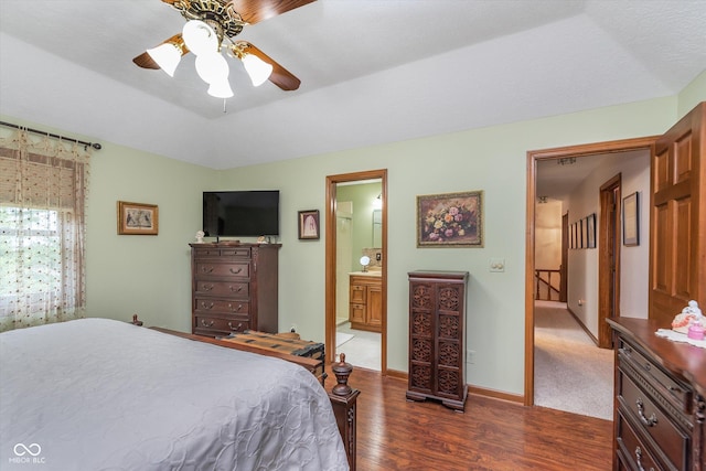 7020 N 375 E, Lebanon, IN 46052 - bedroom featuring ensuite bathroom, dark wood-style flooring, ceiling fan, and baseboards