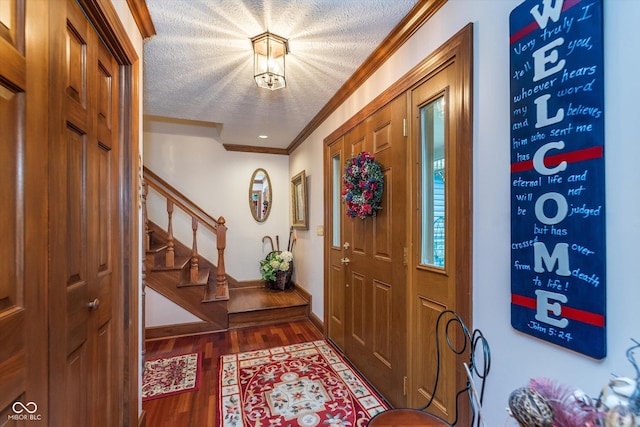 7020 N 375 E, Lebanon, IN 46052 - foyer entrance featuring crown molding, a textured ceiling, baseboards, wood finished floors, and stairway
