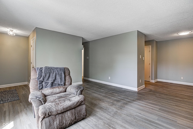 6814 Summer Time Dr, Indianapolis, IN 46226 - living area featuring baseboards, a textured ceiling, and wood finished floors