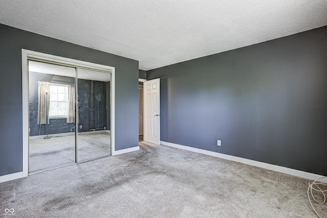 6814 Summer Time Dr, Indianapolis, IN 46226 - unfurnished bedroom featuring carpet floors, a textured ceiling, baseboards, and a closet