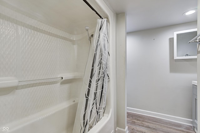 6814 Summer Time Dr, Indianapolis, IN 46226 - full bathroom featuring vanity, baseboards, shower / bathtub combination with curtain, and wood finished floors