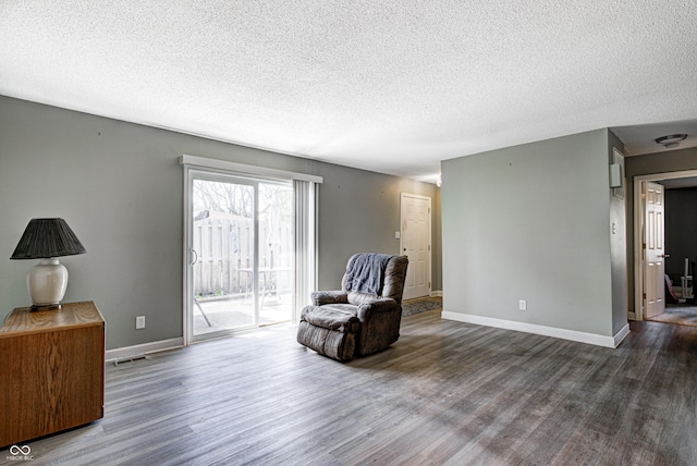 6814 Summer Time Dr, Indianapolis, IN 46226 - living area featuring visible vents, a textured ceiling, and wood finished floors