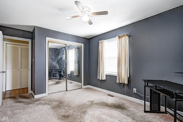6814 Summer Time Dr, Indianapolis, IN 46226 - unfurnished bedroom with a textured ceiling, carpet, a ceiling fan, baseboards, and visible vents