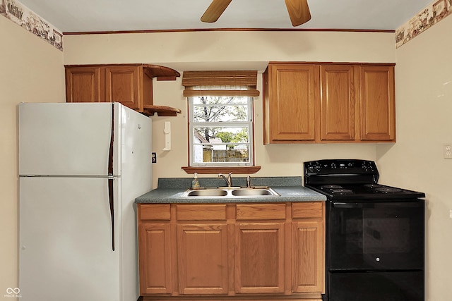 2307 Magnolia Pl, Indianapolis, IN 46219 - kitchen featuring freestanding refrigerator, black electric range oven, a sink, and dark countertops