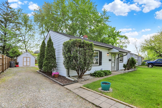 2307 Magnolia Pl, Indianapolis, IN 46219 - view of front of property featuring a storage shed, a chimney, and an outdoor structure