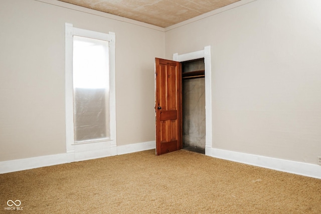 307 N Main St, Carthage, IN 46115 - unfurnished bedroom featuring carpet flooring and a closet