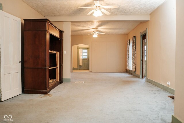 307 N Main St, Carthage, IN 46115 - unfurnished living room featuring carpet floors and a ceiling fan
