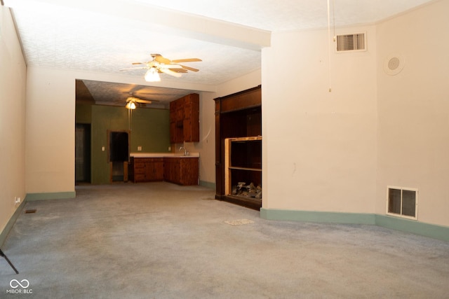 307 N Main St, Carthage, IN 46115 - unfurnished living room with light carpet and a ceiling fan