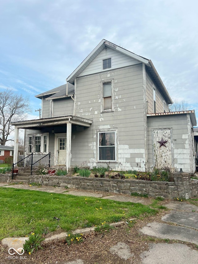 307 N Main St, Carthage, IN 46115 - view of front of house featuring covered porch
