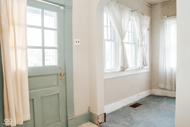 307 N Main St, Carthage, IN 46115 - entrance foyer with arched walkways and carpet flooring