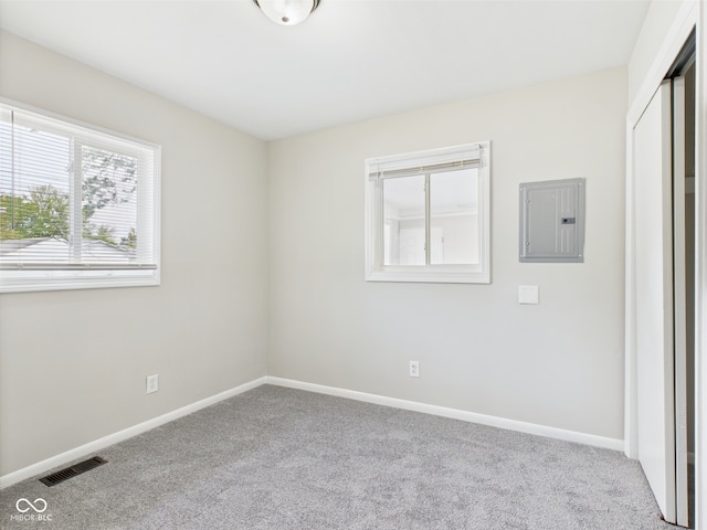 979 Monroe St, Indianapolis, IN 46229 - carpeted empty room featuring visible vents, baseboards, and electric panel