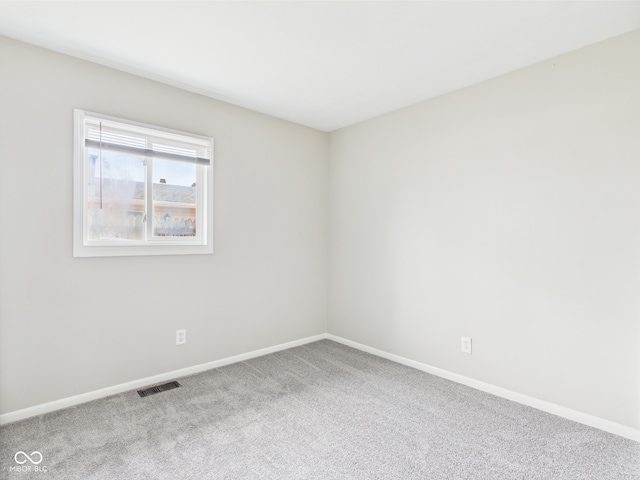 979 Monroe St, Indianapolis, IN 46229 - empty room with visible vents, carpet, and baseboards