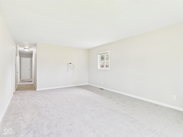 979 Monroe St, Indianapolis, IN 46229 - empty room with baseboards and carpet