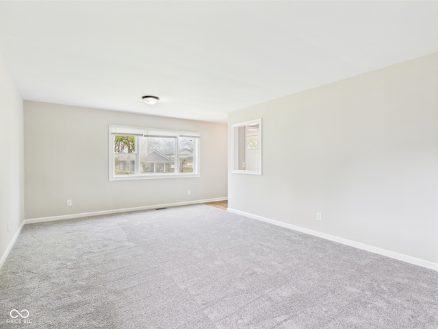 979 Monroe St, Indianapolis, IN 46229 - unfurnished room with baseboards and carpet