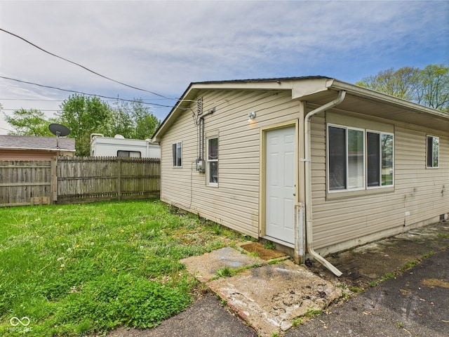 979 Monroe St, Indianapolis, IN 46229 - view of side of property featuring fence and a yard