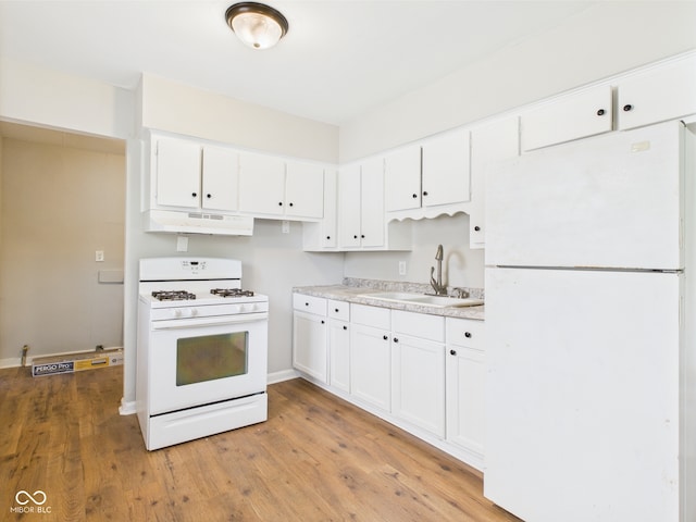 979 Monroe St, Indianapolis, IN 46229 - kitchen with a sink, white appliances, white cabinetry, light wood-type flooring, and under cabinet range hood