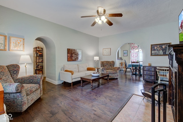 120 W S St, Tipton, IN 46072 - living area with arched walkways, baseboards, a ceiling fan, and wood finished floors