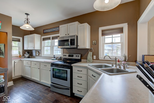 120 W S St, Tipton, IN 46072 - kitchen with white cabinets, appliances with stainless steel finishes, a sink, and light countertops