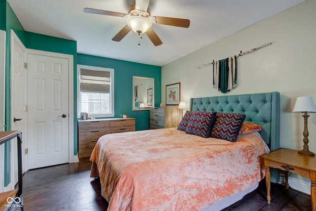 120 W S St, Tipton, IN 46072 - bedroom featuring ceiling fan, dark wood-style flooring, and a textured ceiling