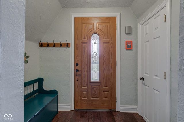 120 W S St, Tipton, IN 46072 - entryway with a textured wall, a textured ceiling, baseboards, dark wood-type flooring, and vaulted ceiling