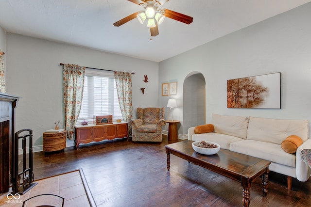120 W S St, Tipton, IN 46072 - living room featuring baseboards, arched walkways, a ceiling fan, and wood finished floors